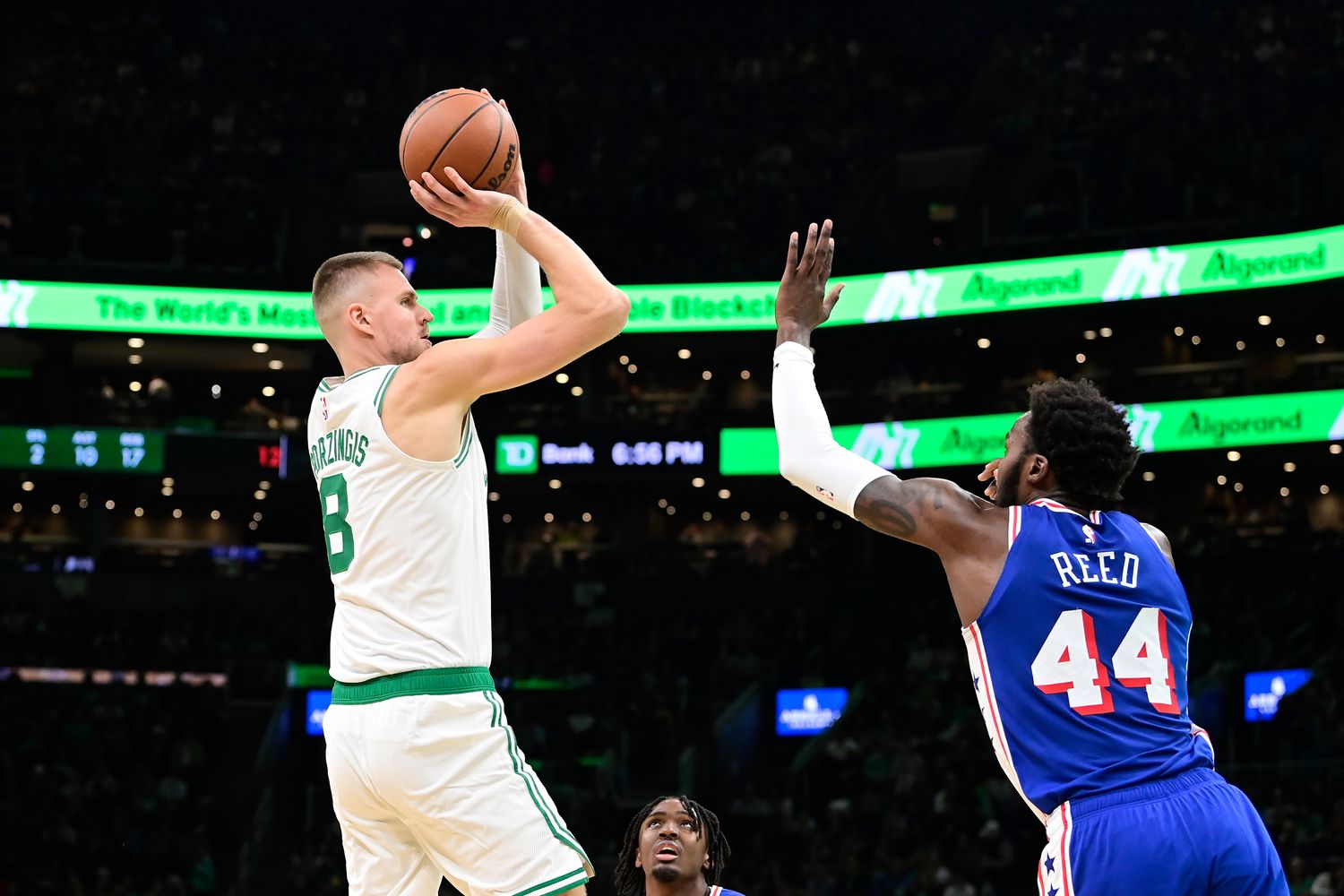 Boston Celtics center Kristaps Porzingis (8) shoots against Philadelphia 76ers forward Paul Reed (44) during the first half at TD Garden.
